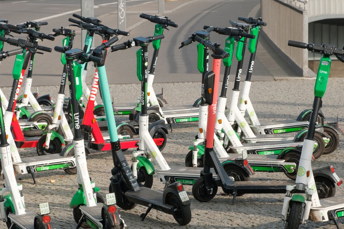 Many Electric E scooters , escooter or e-scooter  on street  in